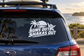 Car rear window vinyl decal with "SUNS OUT SHAKAS OUT" text and palm tree icon