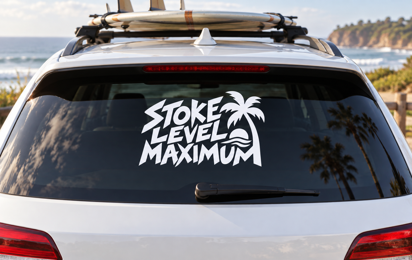 Stoke Level Maximum vinyl decal with bold lettering, palm tree, and wave graphic on car
