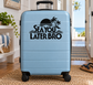 Vinyl decal featuring palm trees, waves, and 'Sea You Later Bro' text on a suitcase