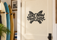 Black vinyl decal reading "SURF NOW ADULT LATER" with surfboard-style graphic