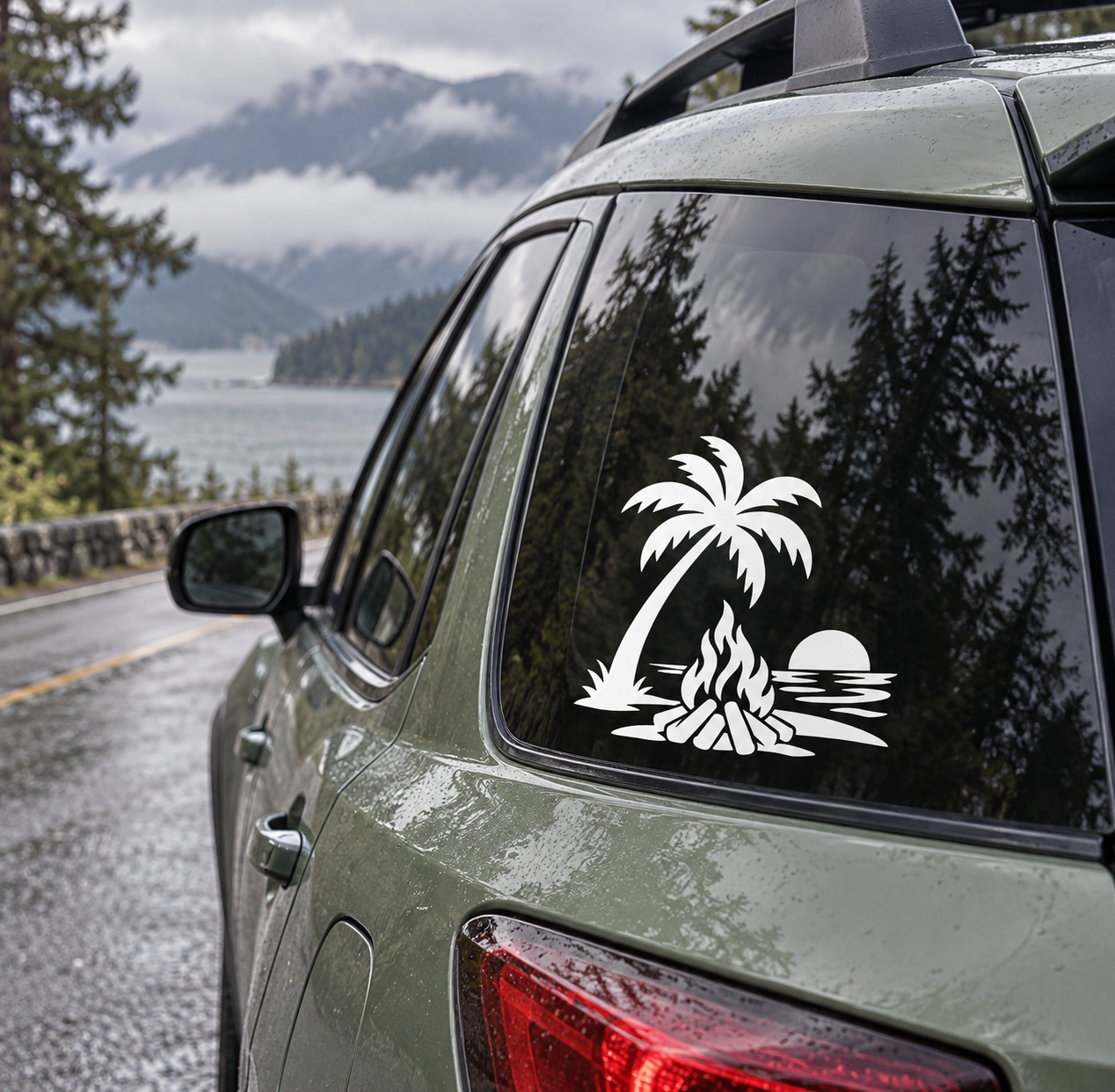 Palm and bonfire vinyl decal on dark car window glass, white design with flames