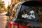 Car window vinyl decal with black van, palm tree, and beach campfire graphic