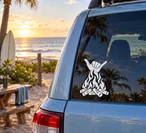 White shaka hand with flames and crossed firewood vinyl decal on car window