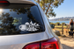 Black campfire coffee vinyl decal on car rear window, cup and flames design