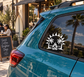 Tropical vinyl badge decal with flaming sun and palm trees, black and white emblem