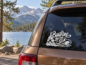 Vinyl decal on car window: Bonfire By The Sea logo with flames and waves