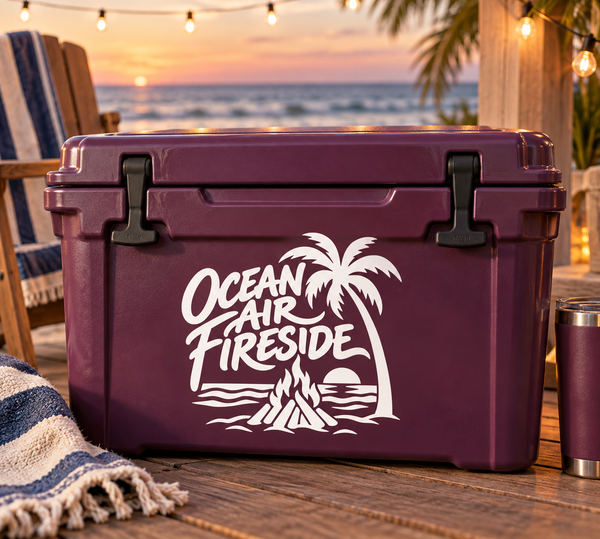 Vinyl decal with white beach campfire design on a purple cooler.