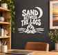 Vinyl decal with “Sand Between the Logs” text and campfire flame icon