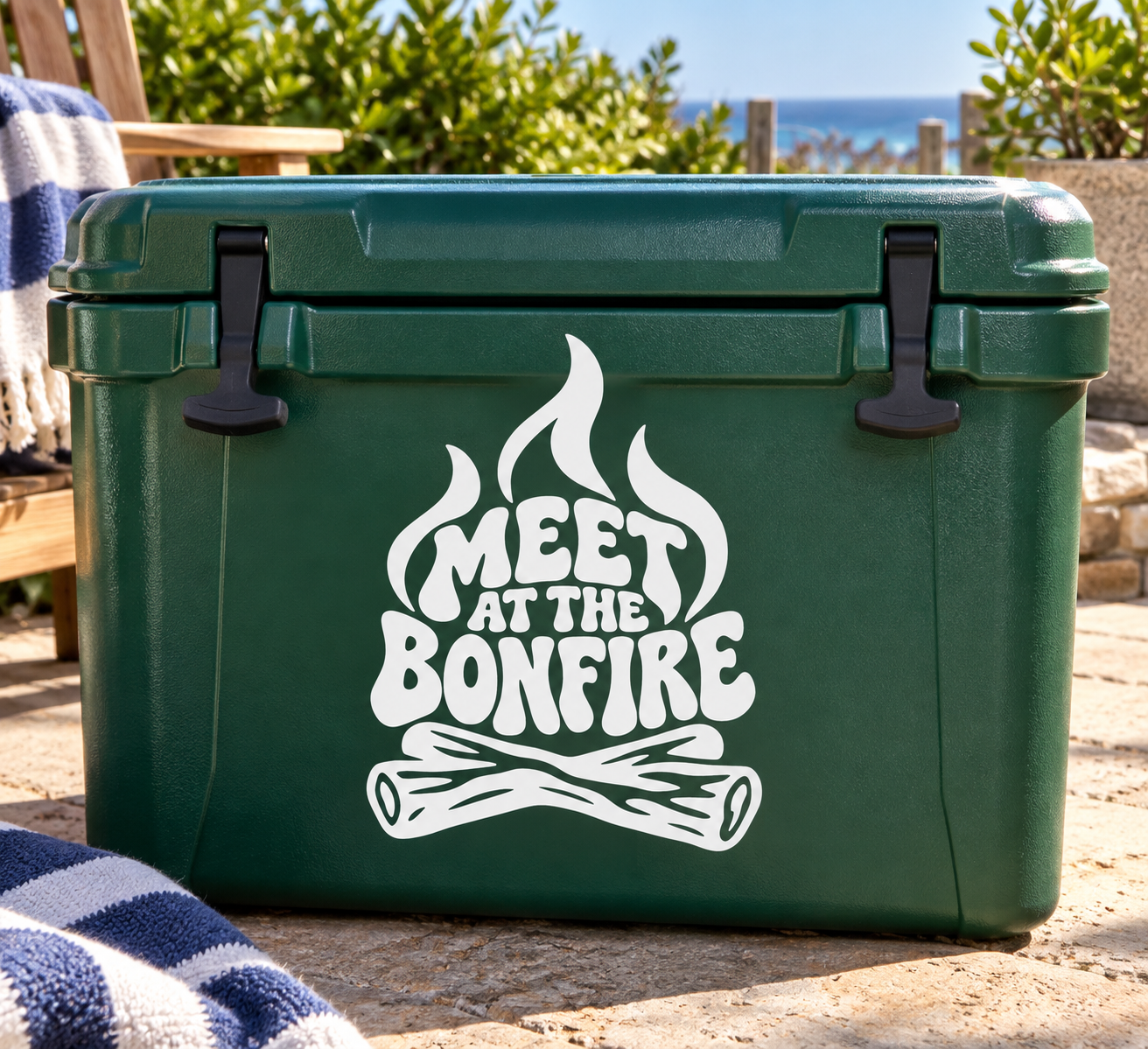 Vinyl decal with 'MEET AT THE BONFIRE' flame and log graphic on green cooler.