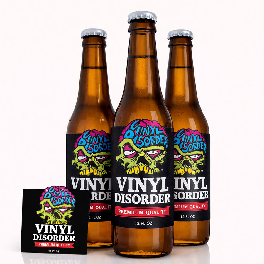 Beer label stickers on three amber beer bottles with colorful skull graphic labels