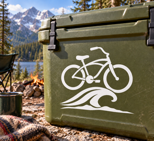 White bicycle and ocean crest vinyl decal on dark green surface