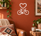 Bicycle frame vinyl decal with white heart above bicycle icon