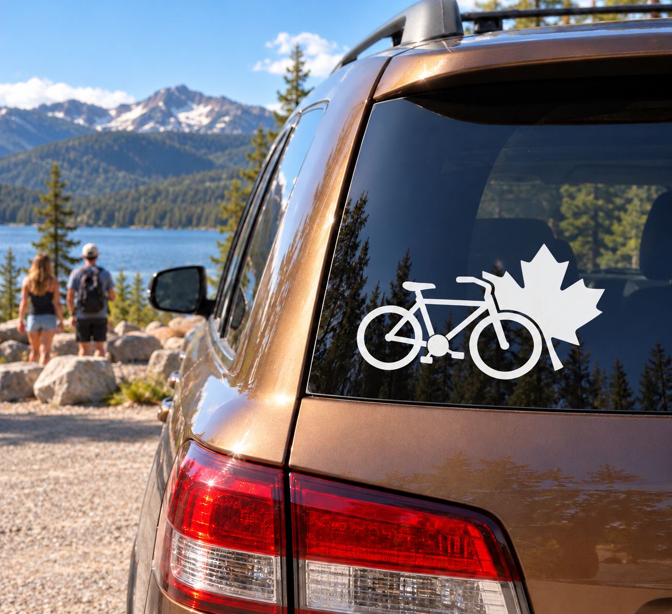 White bicycle and maple leaf vinyl decal on car rear window