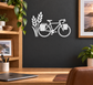 White vinyl bicycle decal with wheat emblem and bicycle silhouette on a wall