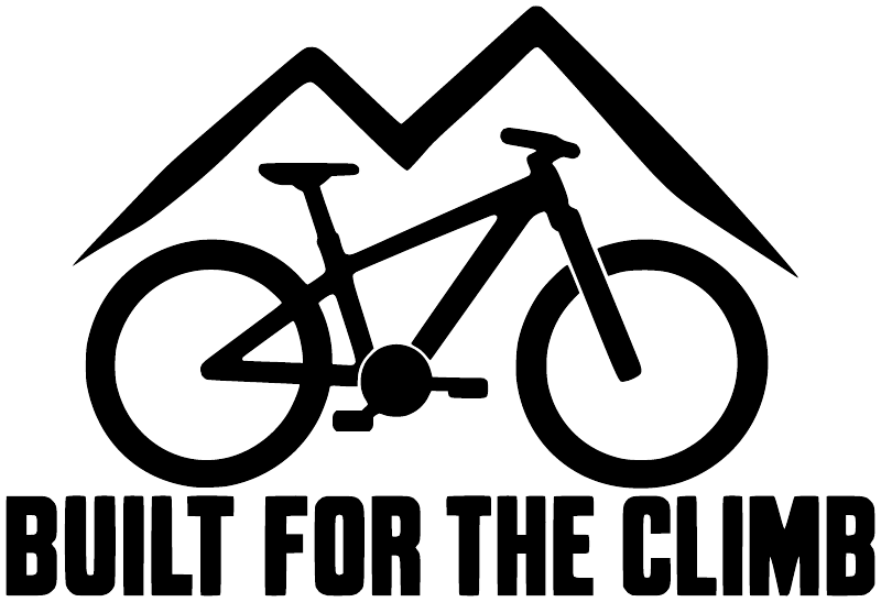 Close-up black vinyl bike decal: mountain peak, rider silhouettes, and 'Built for the Climb'
