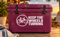Vinyl decal with bike icon and "KEEP THE WHEELS TURNING" text on maroon
