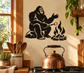 Black Bigfoot vinyl wall decal with campfire flames and tented rocks