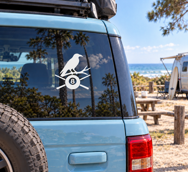 Raven and 8-ball vinyl decal on vehicle window