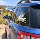 Vinyl decal of lighthouse, 8 ball, and waves on a car rear window