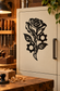 Black mechanized rose vinyl decal with gears and leafed branches on door