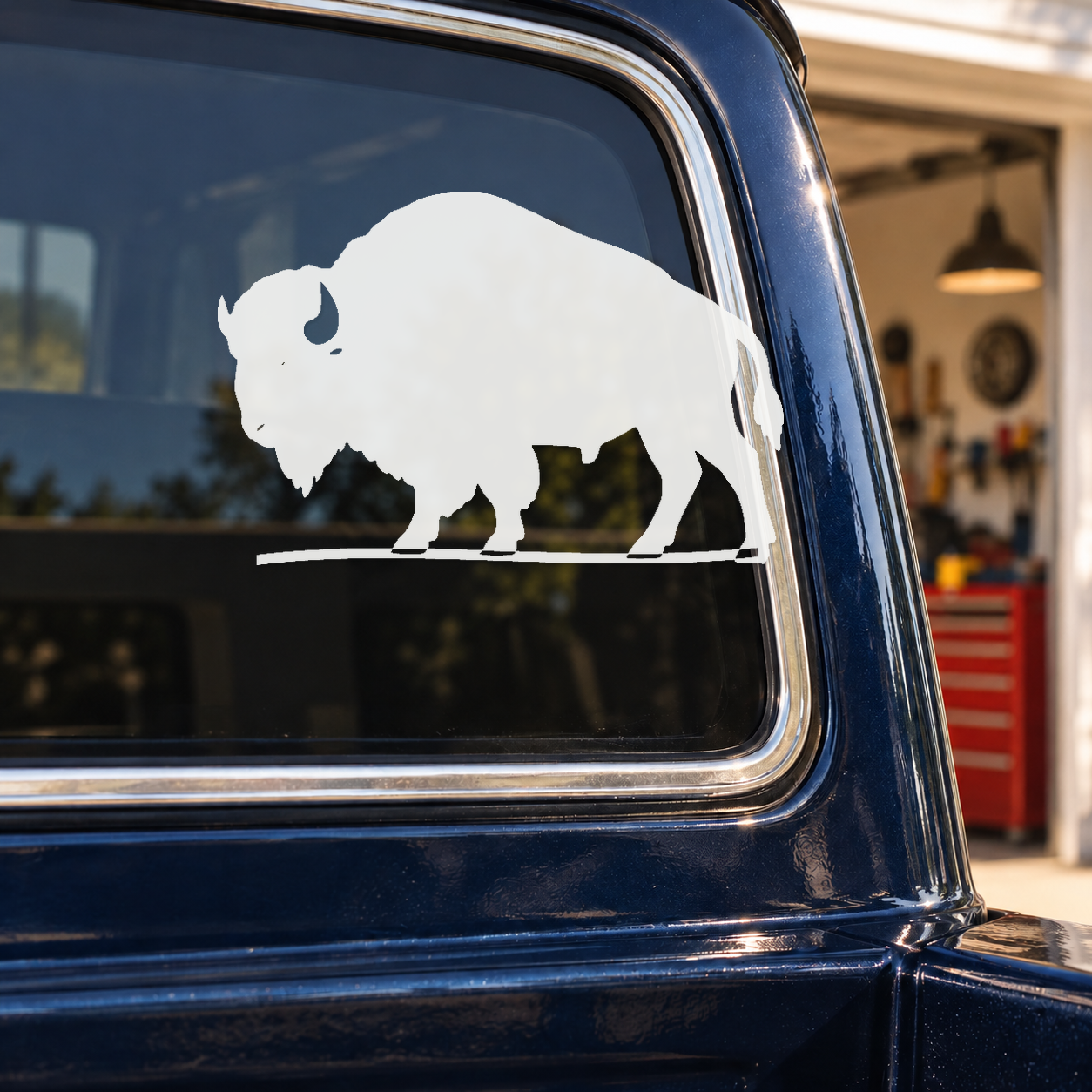 White bison vinyl decal with rolling ground sweep on blue window