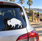 Vinyl decal of standing bison silhouette with curved horns, applied on car window