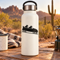 Black bobsled with two crew riders vinyl decal on white bottle