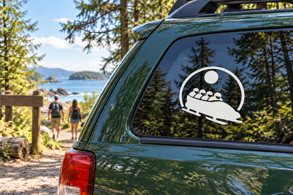 Vinyl car decal featuring a black bobsled team inside a white circular badge