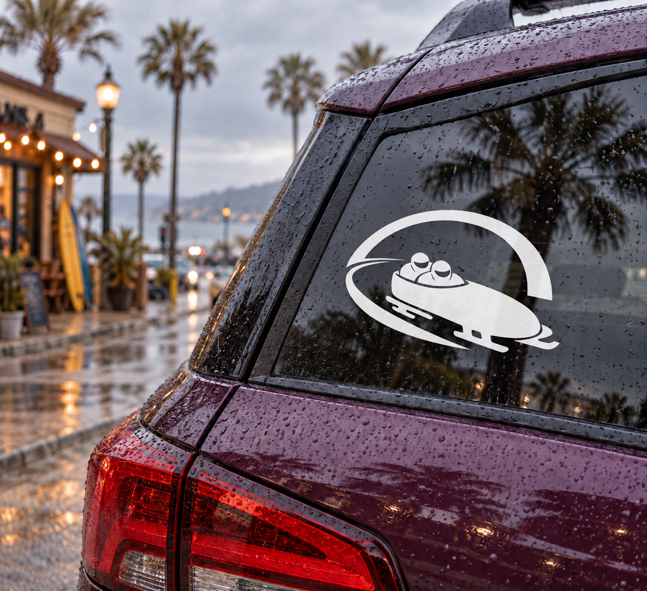 Bobsled tunnel approach vinyl decal on vehicle window, white bobsled icon with arc.