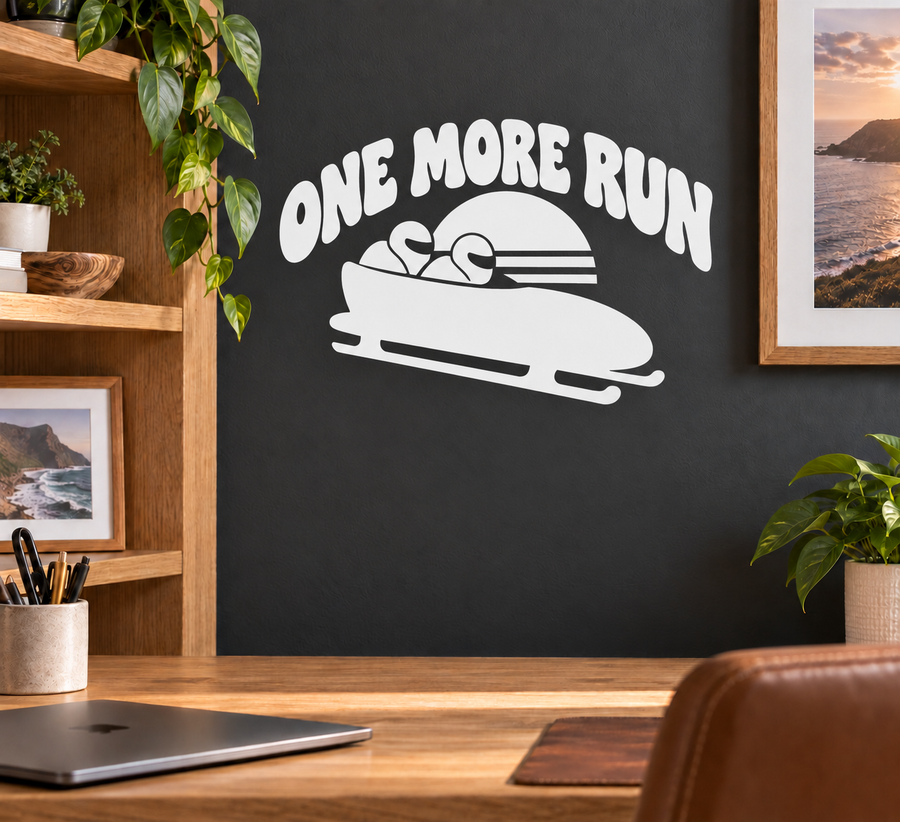 Vinyl decal: 'ONE MORE RUN' with bobsled graphic, white design on dark