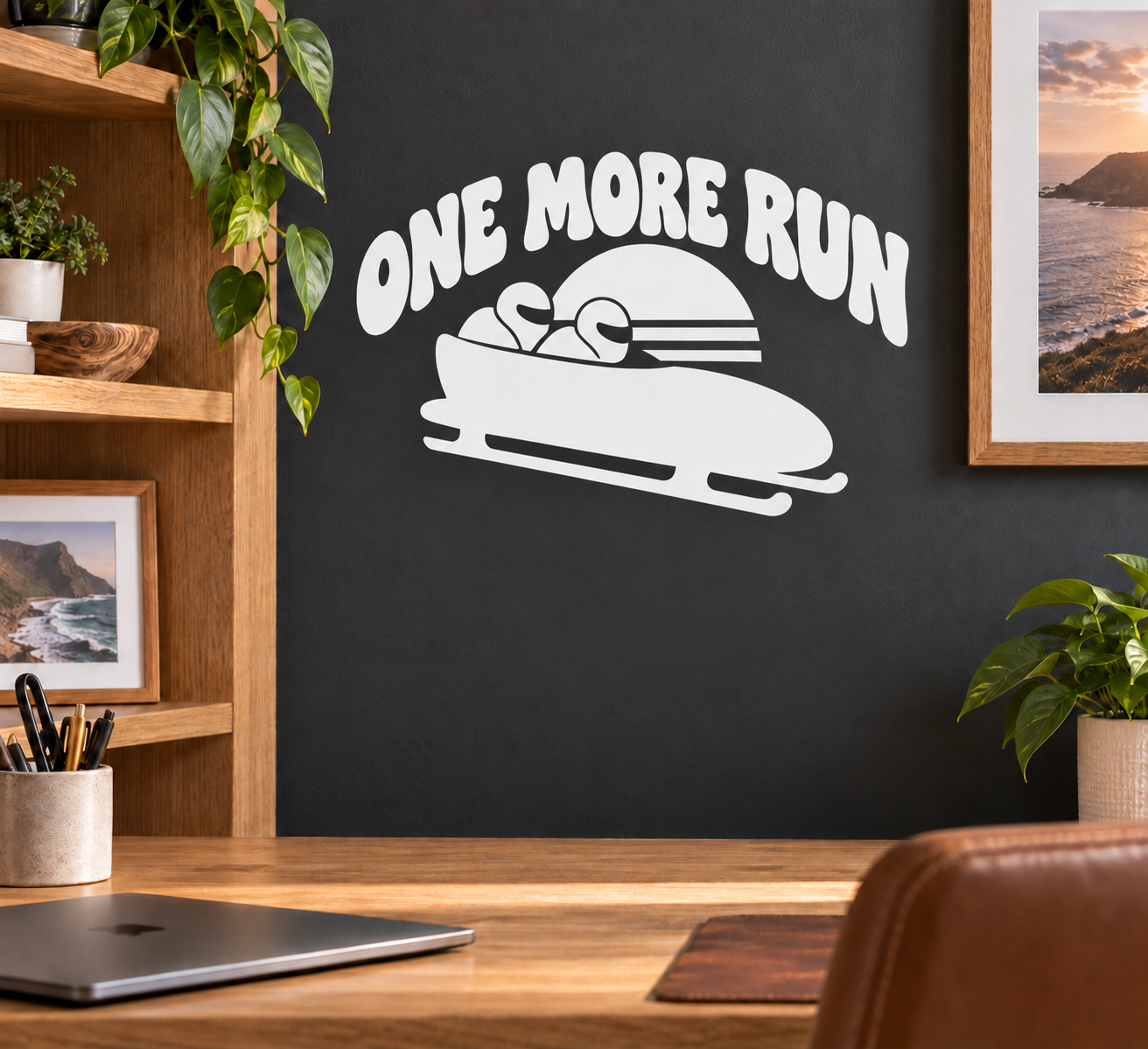 Vinyl decal: 'ONE MORE RUN' with bobsled graphic, white design on dark