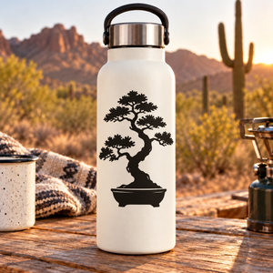Vinyl decal of bonsai tree with layered foliage in oval pot on a white bottle
