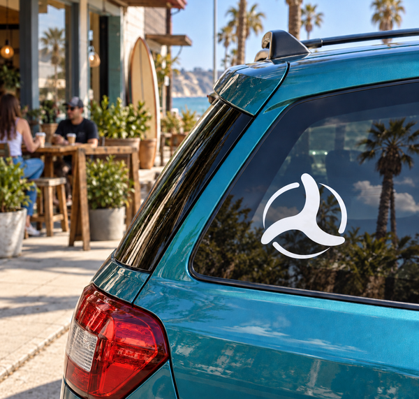Three-wing boomerang vinyl decal on car rear window, white logo on dark glass