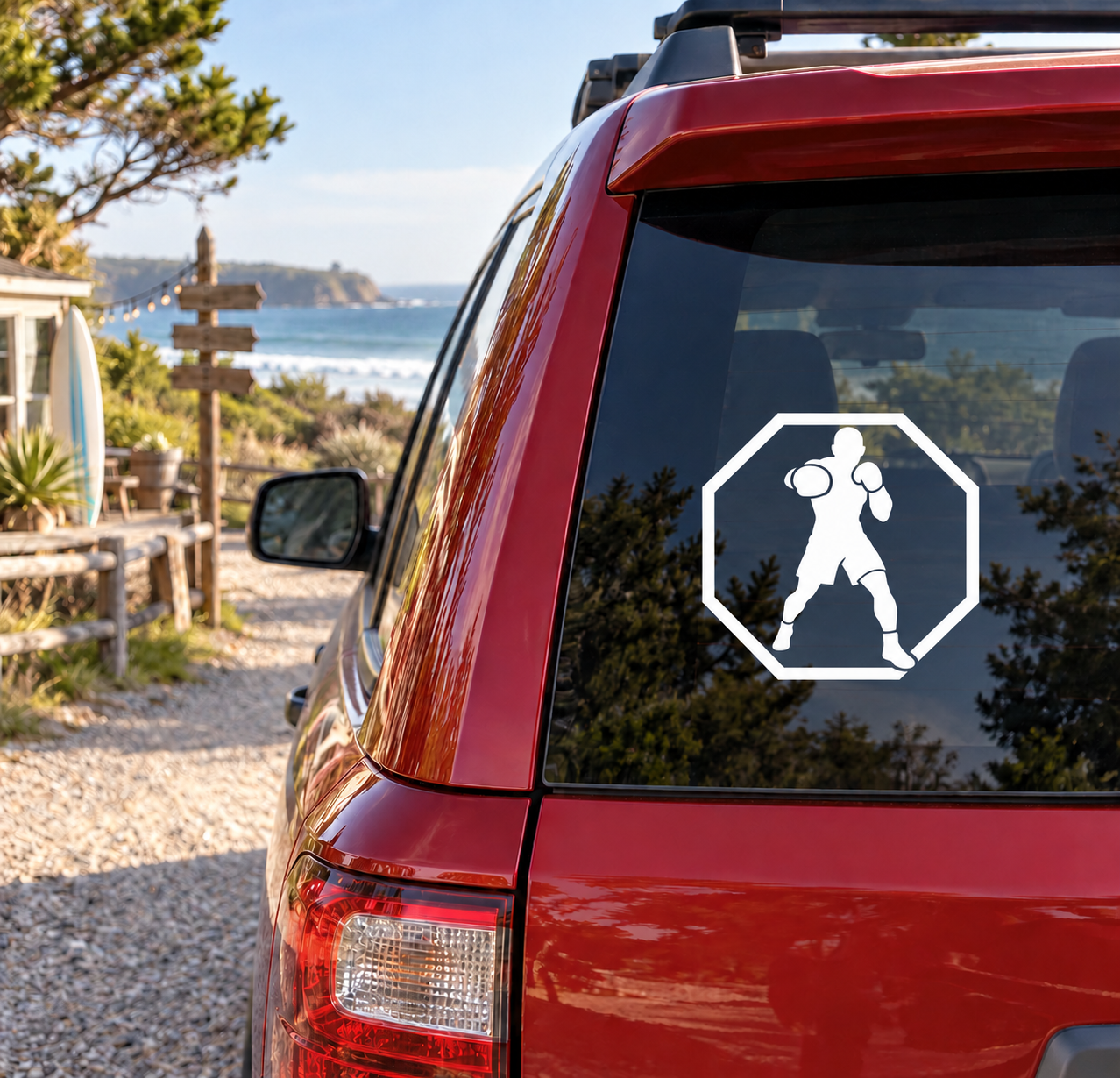 Boxing shadow vinyl decal on car window, octagon with white boxer silhouette throwing punches.