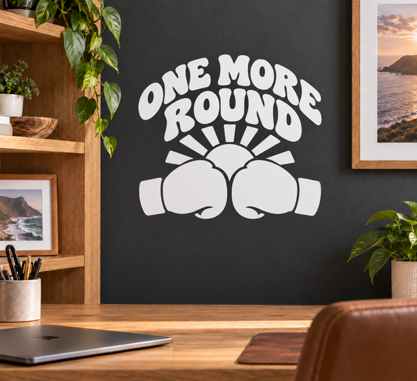 Round boxing vinyl decal: 'ONE MORE ROUND' text, gloves and sunburst