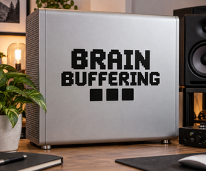 Brain Buffering vinyl decal with pixel-style text on a computer front