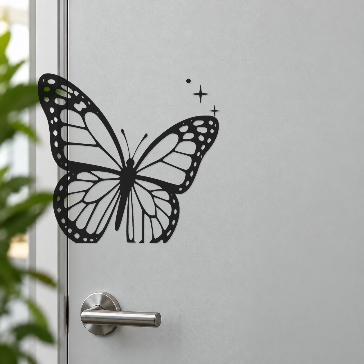 Black and white butterfly wall decal with dotted wing borders and small star sparkles