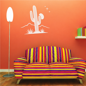 Desert cactus wall decal with moon and star sparkles, shown on a living room wall