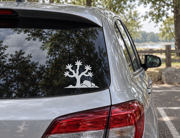 Joshua tree vinyl decal in white on car rear window with desert rocks