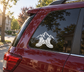 Vinyl decal of mountain peaks and hiking boots on a car window