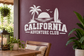 White vinyl decal with palm trees, surfboard, and “CALIFORNIA ADVENTURE CLUB” text