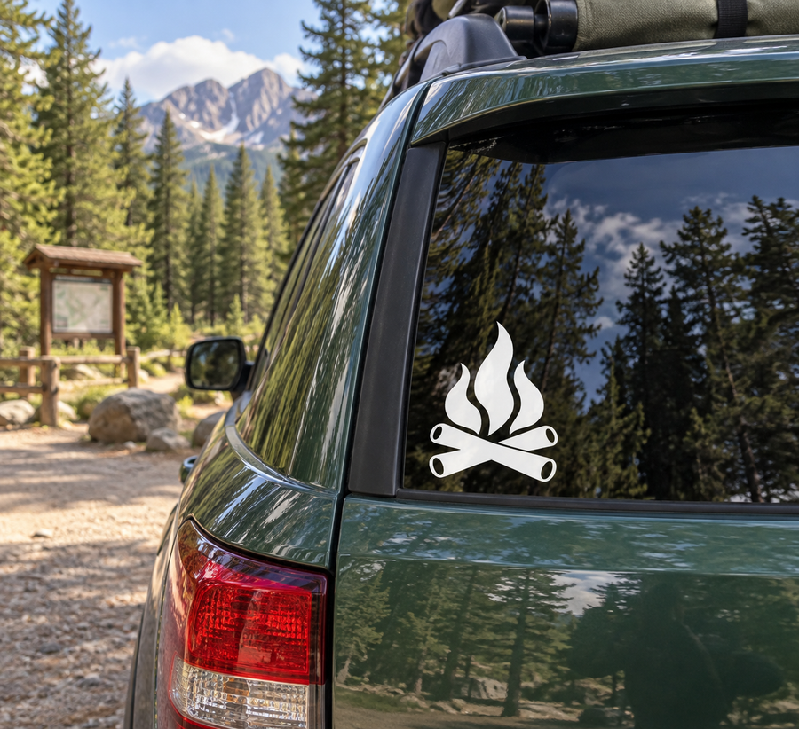 Black campfire flame and crossed log vinyl decal on vehicle rear window