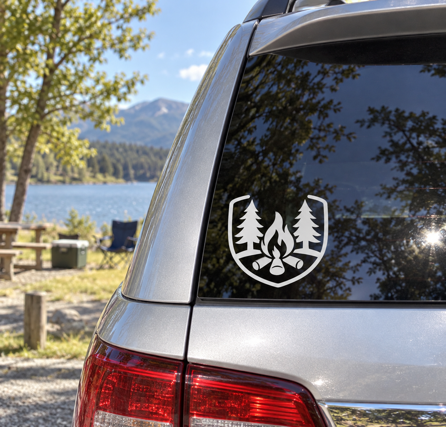 White fire-and-trees badge vinyl decal on vehicle window glass