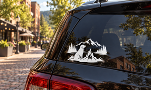 Mountain dog camp vinyl decal with black dog, mountains, trees, and campfire scene