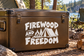 Vinyl decal with FIREWOOD AND FREEDOM lettering, campfire and mountain graphic on black