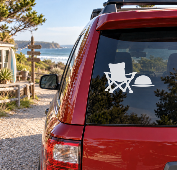 White vinyl decal of reclining camp chair with sun and beach umbrella on car window