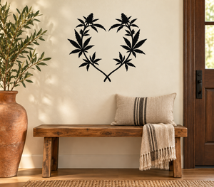 Heart-shaped cannabis leaf vinyl decal, black leaves on light background