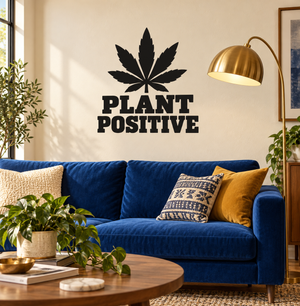 Vinyl decal with black cannabis leaf and text "PLANT POSITIVE" on wall