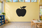 Apple chalkboard vinyl decal with bold black apple shape on wall