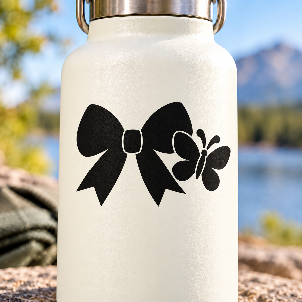 White background vinyl decal: black cheer bow with small butterfly accent